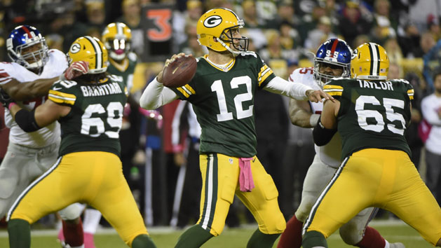 Oct 9, 2016; Green Bay, WI, USA; Green Bay Packers quarterback Aaron Rodgers (12) passes in the third quarter during the game against the New York Giants at Lambeau Field. Photo Credit: Benny Sieu-USA TODAY Sports