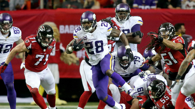 Nov 29, 2015; Atlanta, GA, USA; Minnesota Vikings running back Adrian Peterson (28) runs past Atlanta Falcons defensive end Kroy Biermann (71) and linebacker Philip Wheeler (51) in the fourth quarter of their game at the Georgia Dome. The Vikings won 20-10. Mandatory Credit: Jason Getz-USA TODAY Sports