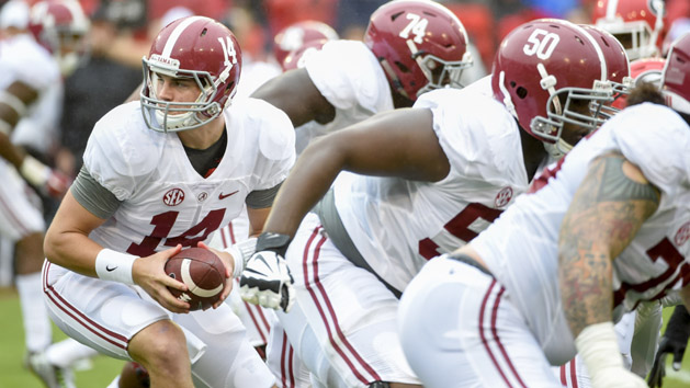 Oct 3, 2015; Athens, GA, USA; Alabama Crimson Tide quarterback Jake Coker (14) looks for the handoff during the first quarter Georgia Bulldogs at Sanford Stadium. Mandatory Credit: John David Mercer-USA TODAY Sports