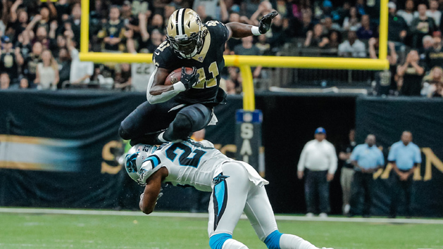 Dec 3, 2017; New Orleans, LA, USA; New Orleans Saints running back Alvin Kamara (41) hurdles over Carolina Panthers cornerback Daryl Worley (26) for a first down during the fourth quarter at the Mercedes-Benz Superdome. The Saints defeated the Panthers 31-21. Photo Credit: Derick E. Hingle-USA TODAY Sports