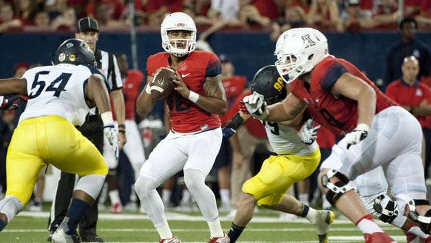 Sep 19, 2015; Tucson, AZ, USA; Arizona Wildcats quarterback Anu Solomon (12) looks to pass during the second quarter against the Northern Arizona Lumberjacks at Arizona Stadium. Mandatory Credit: Casey Sapio-USA TODAY Sports