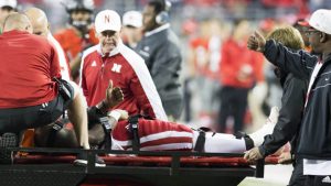 Nebraska QB Armstrong taken off field on stretcher