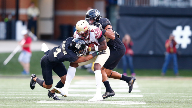 Sep 30, 2017; Winston-Salem, NC, USA; Florida State Seminoles wide receiver Auden Tate (18) os tackled by Wake Forest Demon Deacons defensive back Amari Henderson (4) in the fourth quarter at BB&T Field. Photo Credit: Jeremy Brevard-USA TODAY Sports