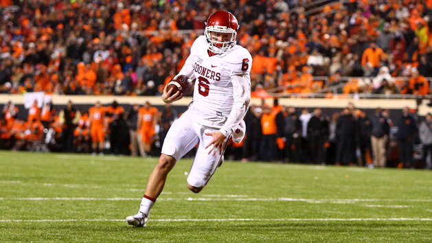 Nov 28, 2015; Stillwater, OK, USA; Oklahoma Sooners quarterback Baker Mayfield (6) runs the ball for a touchdown in the second half against the Oklahoma State Cowboys at Boone Pickens Stadium. The Sooners defeated the Cowboys 58-23. Mandatory Credit: Mark J. Rebilas-USA TODAY Sports