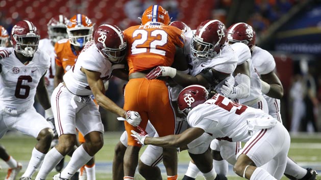 Dec 3, 2016; Atlanta, GA, USA; Florida Gators running back Lamical Perine (22) is brought down by Alabama Crimson Tide defense during the second quarter of the SEC Championship college football game at Georgia Dome. Photo Credit: Jason Getz-USA TODAY Sports