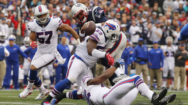 Oct 2, 2016; Foxborough, MA, USA; New England Patriots quarterback Jacoby Brissett (7) fumbles the ball after a hit by Buffalo Bills inside linebacker Zach Brown (53) in the second quarter at Gillette Stadium. Photo Credit: David Butler II-USA TODAY Sports