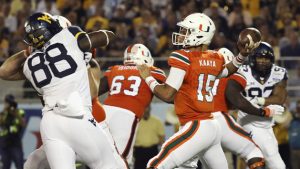 Miami blows past WVU in Russell Athletic Bowl