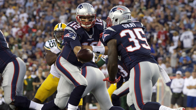 Aug 13, 2015; Foxborough, MA, USA; New England Patriots quarterback Tom Brady (12) hands off the ball to running back Jonas Gray (35) during the first quarter against the Green Bay Packers in a preseason NFL football game at Gillette Stadium. Mandatory Credit: David Butler II-USA TODAY Sports