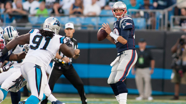 Aug 28, 2015; Charlotte, NC, USA; New England Patriots quarterback Tom Brady (12) looks to pass the ball during the first quarter against the Carolina Panthers at Bank of America Stadium. (Jeremy Brevard-USA TODAY Sports)