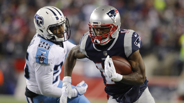 Jan 13, 2018; Foxborough, MA, USA; New England Patriots wide receiver Brandin Cooks (14) runs the ball against Tennessee Titans cornerback Adoree' Jackson (25) during the second quarter in the AFC Divisional playoff game at Gillette Stadium. Photo Credit: David Butler II-USA TODAY Sports