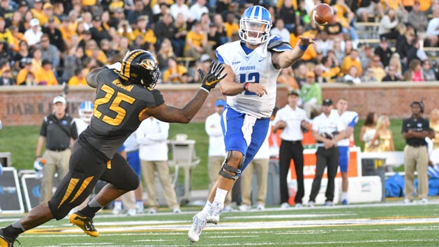 Oct 22, 2016; Columbia, MO, USA; Middle Tennessee Blue Raiders quarterback Brent Stockstill (12) throws a pass as Missouri Tigers linebacker Donavin Newsom (25) pressures during the second half at Faurot Field. Middle Tennessee won 51-45. Photo Credit: Denny Medley-USA TODAY Sports