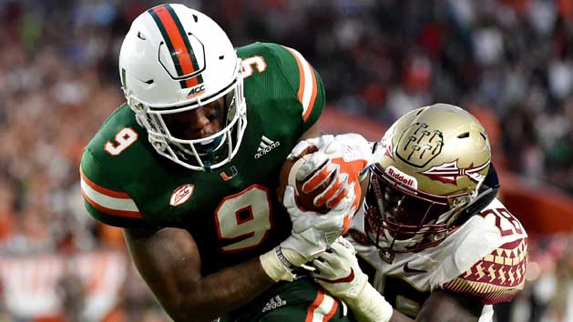 Oct 6, 2018; Miami Gardens, FL, USA; Miami Hurricanes tight end Brevin Jordan (9) runs in a touchdown as Florida State Seminoles linebacker DeCalon Brooks (28) defends the play during the second half at Hard Rock Stadium. Photo Credit: Steve Mitchell-USA TODAY Sports