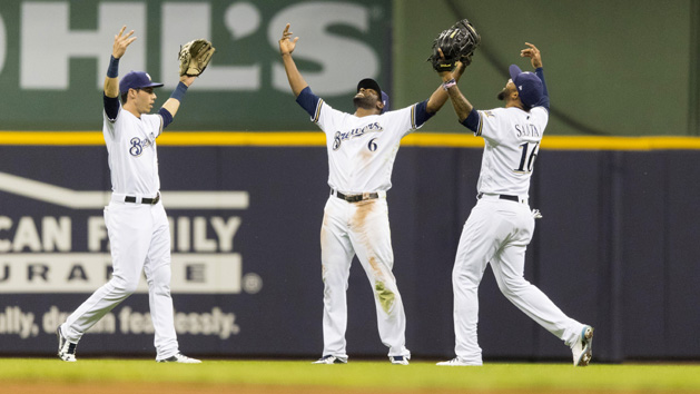 May 22, 2018; Milwaukee, WI, USA; Milwaukee Brewers outfielders Christian Yelich (22) and Lorenzo Cain (6) and Domingo Santana (16) celebrate following the game against the Arizona Diamondbacks at Miller Park. Photo Credit: Jeff Hanisch-USA TODAY Sports