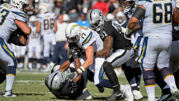 Oct 15, 2017; Oakland, CA, USA; Oakland Raiders defensive end Khalil Mack (52) sacks Los Angeles Chargers quarterback Philip Rivers (17) assisted by Raiders outside linebacker Bruce Irvin (51)during the third quarter of a NFL game at Oakland-Alameda County Coliseum. Photo Credit: Kirby Lee-USA TODAY Sports