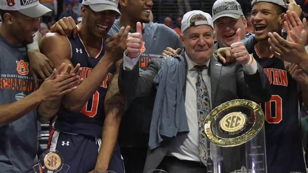Mar 17, 2019; Nashville, TN, USA; Auburn Tigers head coach Bruce Pearl reacts with Auburn forward Horace Spencer (0) and his teammates as his hat is reversed by the team following the championship game between the Tennessee Volunteers and the Auburn Tigers in the SEC conference tournament at Bridgestone Arena. Auburn won 84-64. Photo Credit: Jim Brown-USA TODAY Sports
