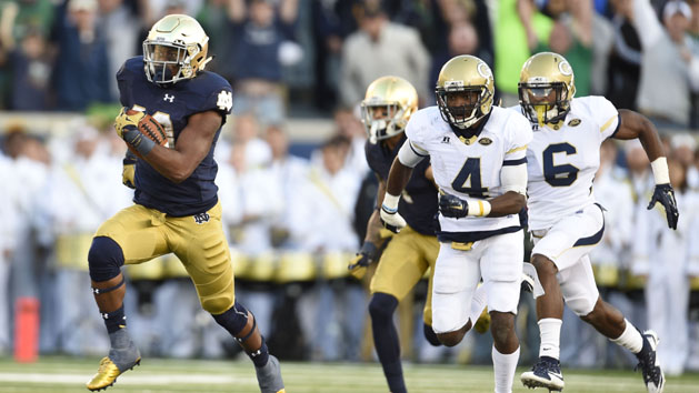 Sep 19, 2015; South Bend, IN, USA; Notre Dame Fighting Irish running back C.J. Prosise (20) carries the ball for a 91 yard touchdown past Georgia Tech Yellow Jackets defensive back Jamal Golden (4) in the fourth quarter at Notre Dame Stadium. Mandatory Credit: RVR Photos-USA TODAY Sports