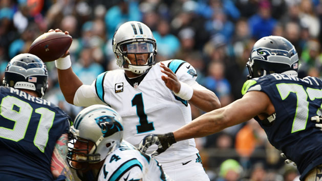 Jan 17, 2016; Charlotte, NC, USA; Carolina Panthers quarterback Cam Newton (1) throws the ball under pressure from Seattle Seahawks defensive end Michael Bennett (72) and Cassius Marsh (91) in the third quarter during the NFC Divisional round playoff game at Bank of America Stadium. Mandatory Credit: Kirby Lee-USA TODAY Sports