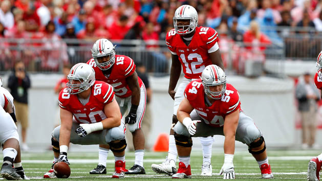 Sep 19, 2015; Columbus, OH, USA; Ohio State Buckeyes offensive lineman Jacoby Boren (50) and Billy Price (54) with Buckeyes quarterback Cardale Jones (12) and running back Ezekiel Elliott (15) in the backfield during the game versus the Northern Illinois Huskies at Ohio Stadium. Ohio State won the game 20-13. Mandatory Credit: Joe Maiorana-USA TODAY Sports