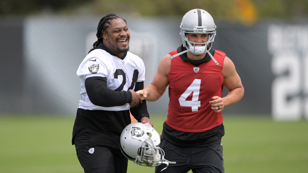 May 30, 2017; Alameda, CA, USA; Oakland Raiders running back Marshawn Lynch (24) and quarterback Derek Carr (4) react at organized team activities at the Raiders practice facility. Photo Credit: Kirby Lee-USA TODAY Sports