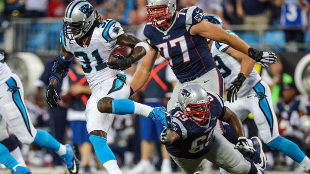 Aug 28, 2015; Charlotte, NC, USA; Carolina Panthers defensive back Charles Tillman (31) intercepts a Tom Brady pass and just gets past New England Patriots center Shaq Mason (69) during the first quarter at Bank of America Stadium. Photo Credit: Jim Dedmon-USA TODAY Sports