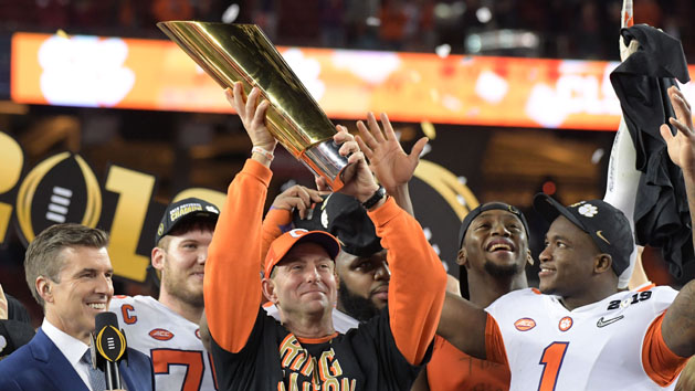 Jan 7, 2019; Santa Clara, CA, USA; Clemson Tigers head coach Dabo Swinney celebrates with the College Football Playoff National Championship trophy on the podium after defeating the Alabama Crimson Tide in the 2019 College Football Playoff Championship game at Levi's Stadium. Photo Credit: Kirby Lee-USA TODAY Sports