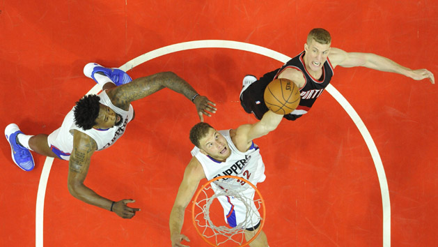 Apr 17, 2016; Los Angeles, CA, USA; Los Angeles Clippers forward Blake Griffin (32) rebounds against Portland Trail Blazers center Mason Plumlee (24) during the first half in game one of the first round of the NBA Playoffs at Staples Center. Mandatory Credit: Richard Mackson-USA TODAY Sports