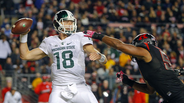 Oct 10, 2015; Piscataway, NJ, USA; Rutgers Scarlet Knights linebacker Quentin Gause (50) puts pressure on Michigan State Spartans quarterback Connor Cook (18) during the second quarter at High Points Solutions Stadium. Mandatory Credit: Jim O'Connor-USA TODAY Sports