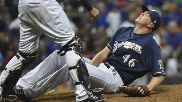 Apr 5, 2018; Milwaukee, WI, USA; Milwaukee Brewers pitcher Corey Knebel (46) grabs his leg in pain after throwing pitch in the ninth inning against the Chicago Cubs at Miller Park. Knebel had to leave the game. Photo Credit: Benny Sieu-USA TODAY Sports