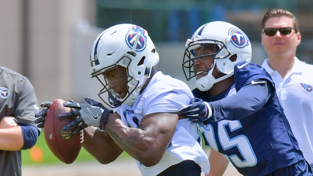 Jun 13, 2017; Nashville, TN, USA; Tennessee Titans wide receiver Corey Davis (84) catches a pass against Tennessee corner back Adoree Jackson (25) St Thomas Sports Park Photo Credit: Jim Brown-USA TODAY Sports