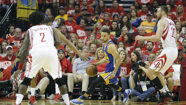 Apr 24, 2016; Houston, TX, USA; Golden State Warriors guard Stephen Curry (30) dribbles against Houston Rockets guard Patrick Beverley (2) and forward Donatas Motiejunas (20) in the first quarter in game four of the first round of the NBA Playoffs at Toyota Center. Photo Credit: Thomas B. Shea-USA TODAY Sports