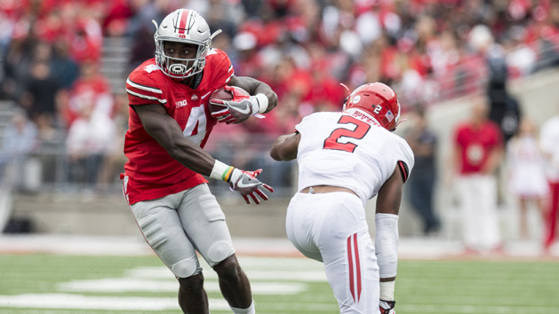 Oct 1, 2016; Columbus, OH, USA; Ohio State Buckeyes running back Curtis Samuel (4) fakes his way around Rutgers Scarlet Knights defensive back Kiy Hester (2) at Ohio Stadium. Ohio State won the game 58-0. Photo Credit: Greg Bartram-USA TODAY Sports