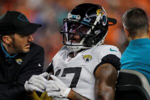 Chark carted off with reported fractured ankle