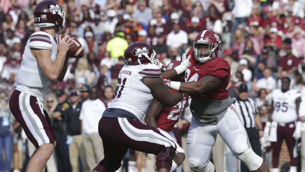 Nov 12, 2016; Tuscaloosa, AL, USA; Alabama Crimson Tide defensive lineman Da'Ron Payne (94) puts pressure on Mississippi State Bulldogs quarterback Nick Fitzgerald (7) as offensive lineman Deion Calhoun (61) blocks him at Bryant-Denny Stadium. The Tide defeated the Bulldogs 51-3. Photo Credit: Marvin Gentry-USA TODAY Sports