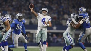 Cowboys roll, keep Lions from clinching playoff spot