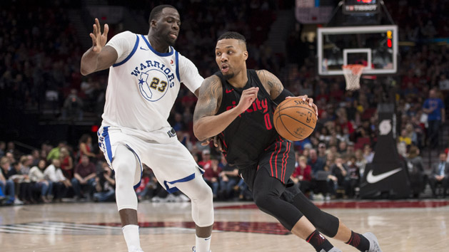 Mar 9, 2018; Portland, OR, USA; Portland Trail Blazers guard Damian Lillard (0) drives to the basket during the second half against Golden State Warriors forward Draymond Green (23) at the Moda Center. The Trail Blazers won 125-108. Photo Credit: Troy Wayrynen-USA TODAY Sports