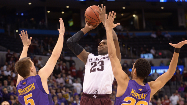 Mar 20, 2016; Oklahoma City, OK, USA; Texas A&M Aggies guard Danuel House (23) shoots against Northern Iowa Panthers guard Matt Bohannon (5) and guard Jeremy Morgan (20) in double overtime during the second round of the 2016 NCAA Tournament at Chesapeake Energy Arena. Mandatory Credit: Mark D. Smith-USA TODAY Sports