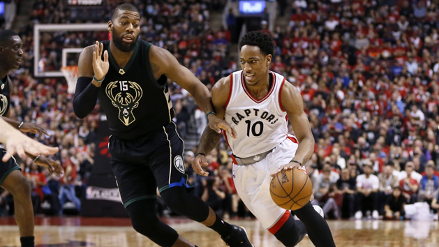 Apr 15, 2017; Toronto, Ontario, CAN; Toronto Raptors guard DeMar DeRozan (10) tries to get around Milwaukee Bucks center Greg Monroe (15) in game one of the first round of the 2017 NBA Playoffs at Air Canada Centre. Milwaukee defeated Toronto 97-83. Photo Credit: John E. Sokolowski-USA TODAY Sports