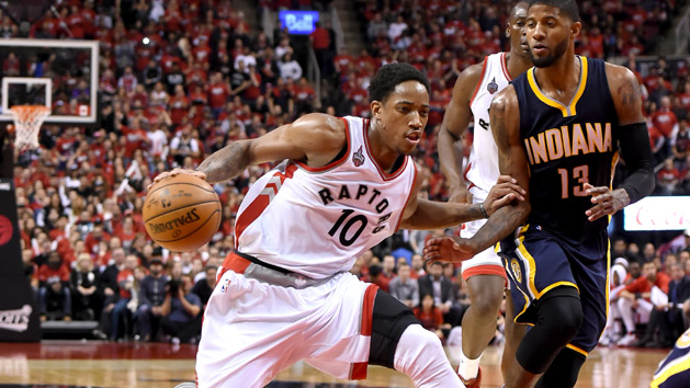 May 1, 2016; Toronto, Ontario, CAN; Toronto Raptors guard DeMar DeRozan (10) dribbles away from Indiana Pacers forward Paul George (13) in game seven of the first round of the 2016 NBA Playoffs at Air Canada Centre. Mandatory Credit: Dan Hamilton-USA TODAY Sports