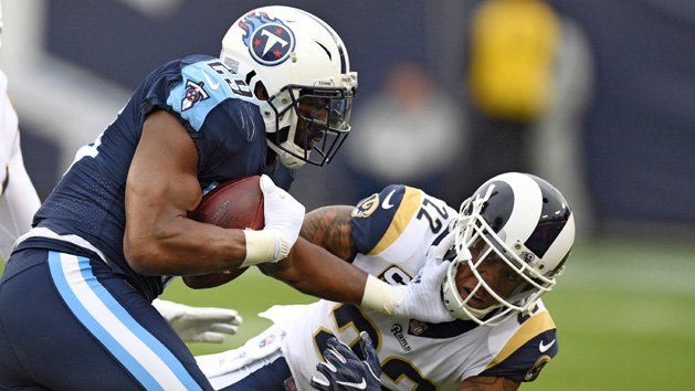 Dec 24, 2017; Nashville, TN, USA; Tennessee Titans running back DeMarco Murray (29) fights off a tackle attempt by /Los Angeles Rams cornerback Trumaine Johnson (22) during the first half at Nissan Stadium. Photo Credit: Christopher Hanewinckel-USA TODAY Sports
