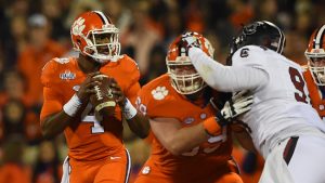 Jackson, Watson split top college football awards