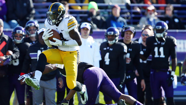 Oct 17, 2015; Evanston, IL, USA; Iowa Hawkeyes defensive back Desmond King (14) intercepts a pass intended for Northwestern Wildcats wide receiver Christian Jones (14) during the first quarter at Ryan Field. Mandatory Credit: Jerry Lai-USA TODAY Sports