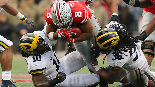Nov 24, 2018; Columbus, OH, USA; Ohio State Buckeyes running back J.K. Dobbins (2) runs past Michigan Wolverines linebacker Devin Bush (10) and linebacker Devin Gil (36) during the third quarter at Ohio Stadium. Photo Credit: Joe Maiorana-USA TODAY Sports