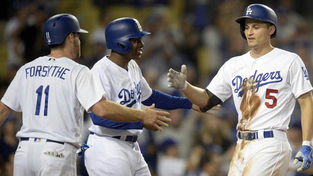 September 26, 2017; Los Angeles, CA, USA; Los Angeles Dodgers shortstop Corey Seager (5) is greeted by second baseman Logan Forsythe (11) and left fielder Curtis Granderson (6) after hitting a three run home run in the seventh inning at Dodger Stadium. Photo Credit: Gary A. Vasquez-USA TODAY Sports