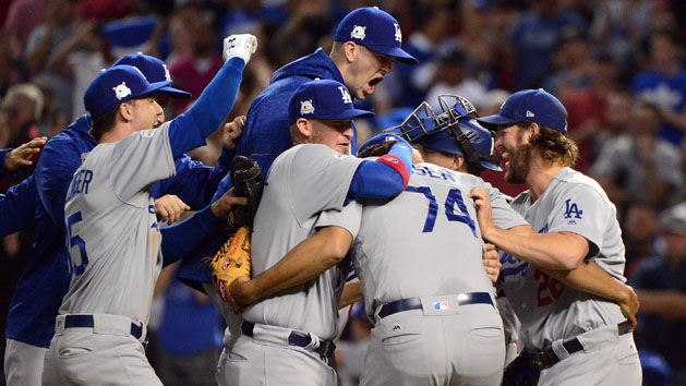 Oct 9, 2017; Phoenix, AZ, USA; Los Angeles Dodgers celebrate the victory against the Arizona Diamondbacks following game three of the 2017 NLDS playoff baseball series at Chase Field. Photo Credit: Matt Kartozian-USA TODAY Sports