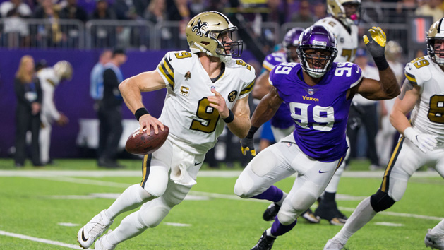 Oct 28, 2018; Minneapolis, MN, USA; New Orleans Saints quarterback Drew Brees (9) scrambles out of the pocket in the third quarter against Minnesota Vikings defensive lineman Danielle Hunter (99) at U.S. Bank Stadium. Photo Credit: Brad Rempel-USA TODAY Sports