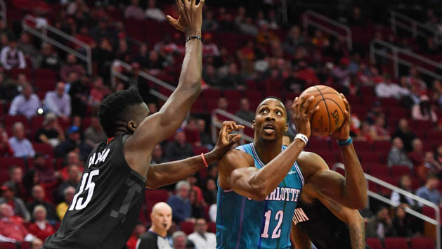 Dec 13, 2017; Houston, TX, USA; Charlotte Hornets center Dwight Howard (12) looks to shoot as Charlotte Hornets guard Kemba Walker (15) guards during the fourth quarter at Toyota Center. Photo Credit: Shanna Lockwood-USA TODAY Sports