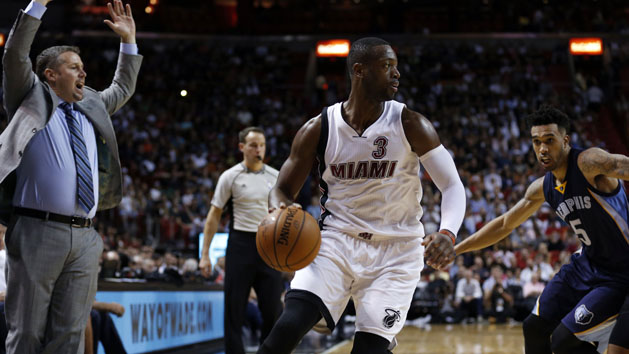 Dec 13, 2015; Miami, FL, USA; Miami Heat guard Dwyane Wade (3) is pressured by Memphis Grizzlies guard Courtney Lee (5) during the second half at American Airlines Arena. The Heat won 100-97. Mandatory Credit: Steve Mitchell-USA TODAY Sports