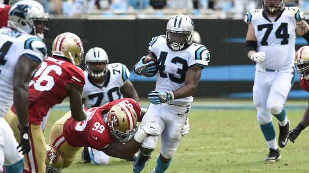 Sep 18, 2016; Charlotte, NC, USA; Carolina Panthers running back Fozzy Whittaker (43) runs as San Francisco 49ers defensive end DeForest Buckner (99) defends in the second quarter at Bank of America Stadium. Photo Credit: Bob Donnan-USA TODAY Sports