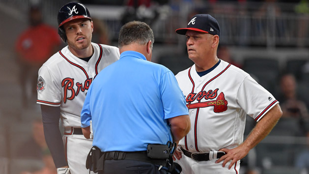 May 17, 2017; Atlanta, GA, USA; Atlanta Braves first baseman Freddie Freeman (5) is checked by the trainer while standing next to manager Brian Snitker (43) after being hit by a pitch against the Toronto Blue Jays during the fifth inning at SunTrust Park. Photo Credit: Dale Zanine-USA TODAY Sports