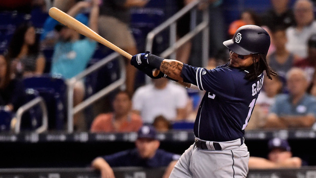 Jun 10, 2018; Miami, FL, USA; San Diego Padres shortstop Freddy Galvis (13) hits a sacrifice fly to score a run in the second inning against the Miami Marlins at Marlins Park. Photo Credit: Jasen Vinlove-USA TODAY Sports